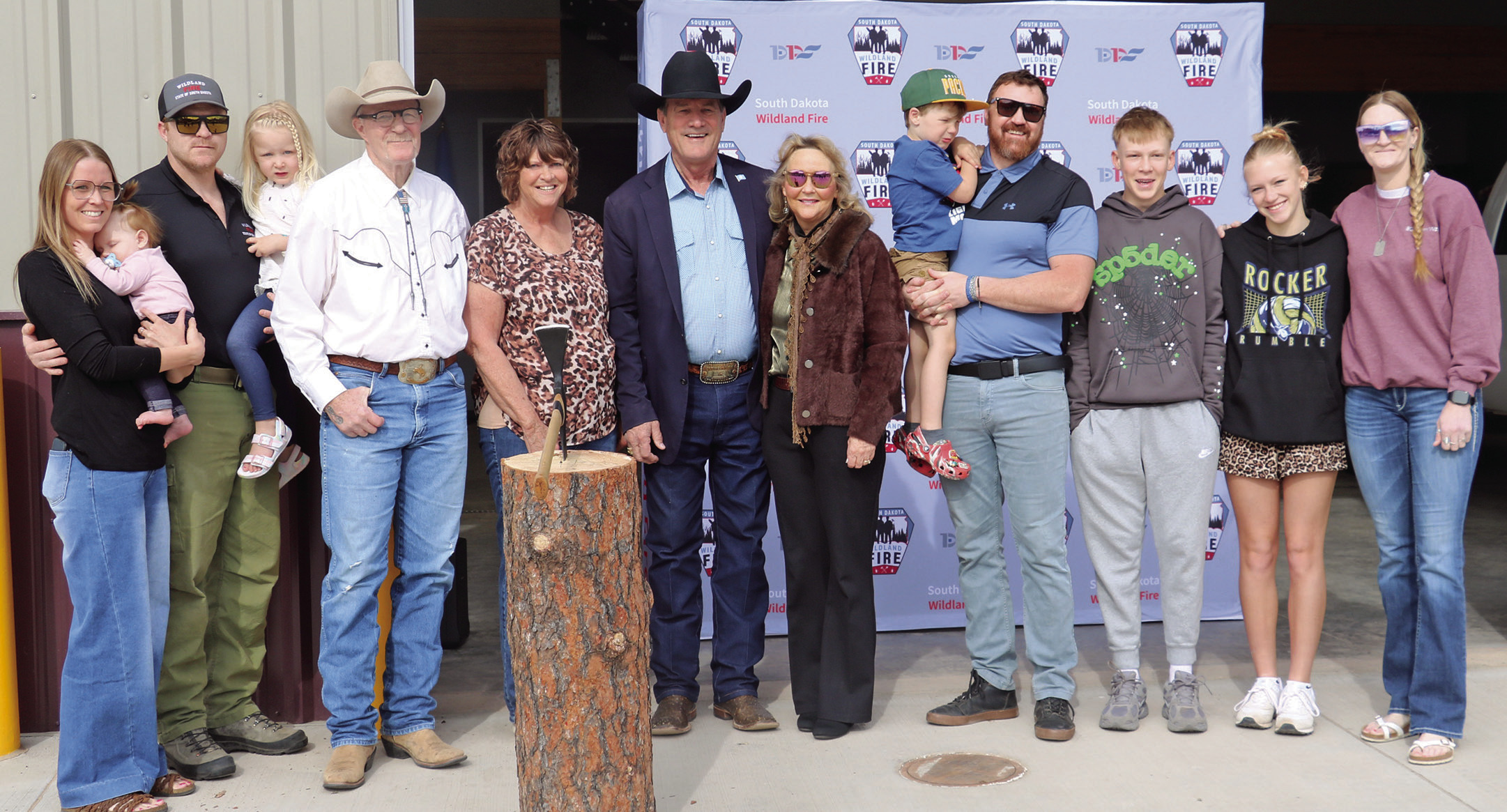 South Dakota Governor Larry Rhoden and his wife Sandy, center, pose with members of the Haskvitz family during a dedication and ribbon cutting held of the new S.D. Wildland Fire building located on the campus of the State Veterans Home. Also pictured from left are John and Laree Haskvitz and their two daughters; Don and Lujean Haskvitz; Ben Haskvitz and his son; Betsy Haskvitz and her children Cash and Ella. Below is the exterior of the building. Photos by Brett Nachtigall/Fall River County Herald-Star