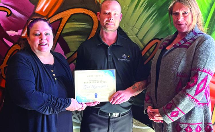 The first-ever recipient of the Superior Service Award was Tad Appenzeller (center) who works at The Dragonfly restaurant. He is pictured with Chamber Director Olivia Mears and Dragonfly owner Kara Hagen. Photo by Zoe Pattiani