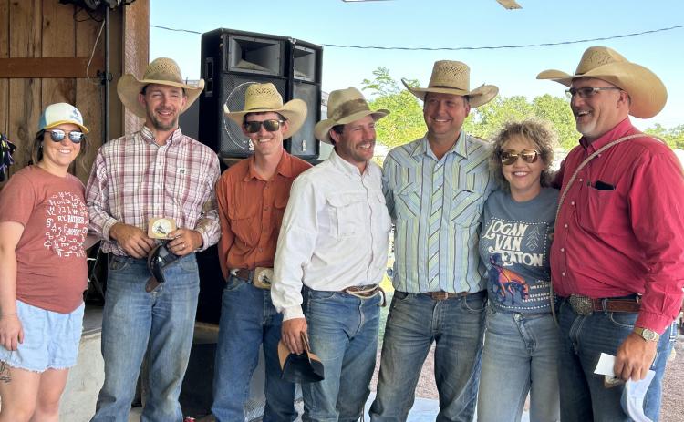 Brott & Company of Lusk, Wyo., won the Logan Van Eaton Memorial Ranch Rodeo. They are pictured here with members of the Van Eaton family including sister Avery (far left) and parents Wyatt and Jess (second & third from right).