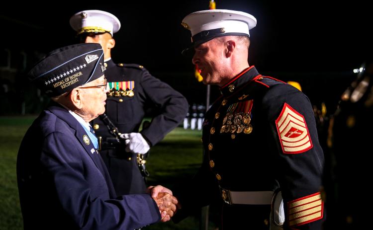 Master Sergeant Tyrell Whitcher (right) says he feels “blessed” to be able to meet Medal of Honor recipients in his capacity as Commandant of the Marine Corps Parade Staff as Senior Enlisted Advisor, Enlisted Parade Commander and Senior Swordsman. Courtesy photo
