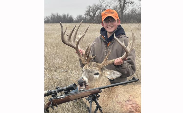 Thirteen-year-old Ian Ferley of Oelrichs, who is a 7th grade student at Edgemont Middle School, holds onto his 17x10 point whitetail buck he harvested with his dad Casey Ferley on Sunday, Nov. 24, on their family ranch. Submitted photo
