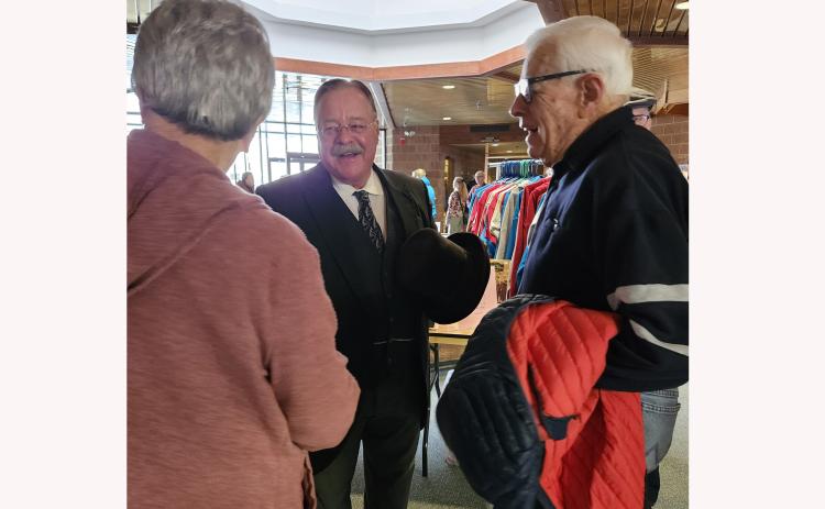 Teddy Roosevelt, portrayed by Joe Wiegand, visits with Mary Hollenbeck and Darrell Dutoit at the 2025 Focus on Fall River County History Conference at the Mueller Center last Saturday in Hot Springs. Photo by Katie Merdanian/Fall River County Herald-Star