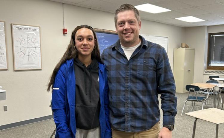 Hot Springs’ Teacher of the Year Tyler Norton stands next to Alaina Daily, who was one of the students who nominated him for the honor. 
