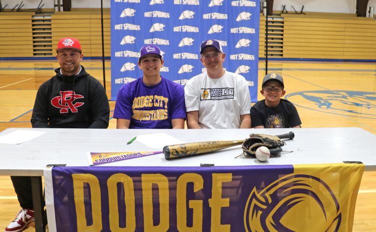 McCoy Rippentrop (second from left) and his dad Matt and younger brother Cole. On left is his Post 22 baseball coach Jace Caldwell. 