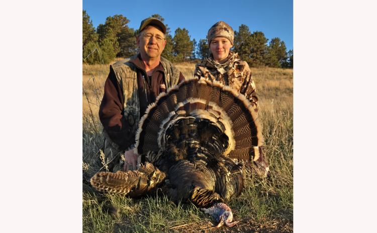 Local NWTF volunteer Dr. Don Massa, left, poses with Kamryn Selzler of Hot Springs, who was the winner of the statewide Hunt of a Lifetime. Submitted photo