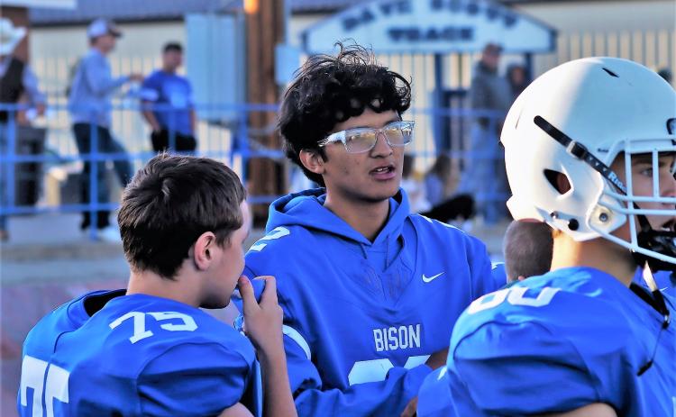 Hot Springs senior Carl Stanton stands with his football team on the sidelines of their game versus Wagner last Friday night at Woodward Field. Stanton is currently preparing for a surgery later this month which will remain a mass on his brain. Photo by Richard Anderson