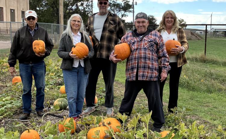 Edgemont Community Garden members and volunteers Larry and Rose Mason, Mike Konopnicki (President), James Garmany and Tracy Petersen show off the brilliant selection of pumpkins they grew for the community pumpkin patch. Photo by Charity Maness / FRCHerald Star