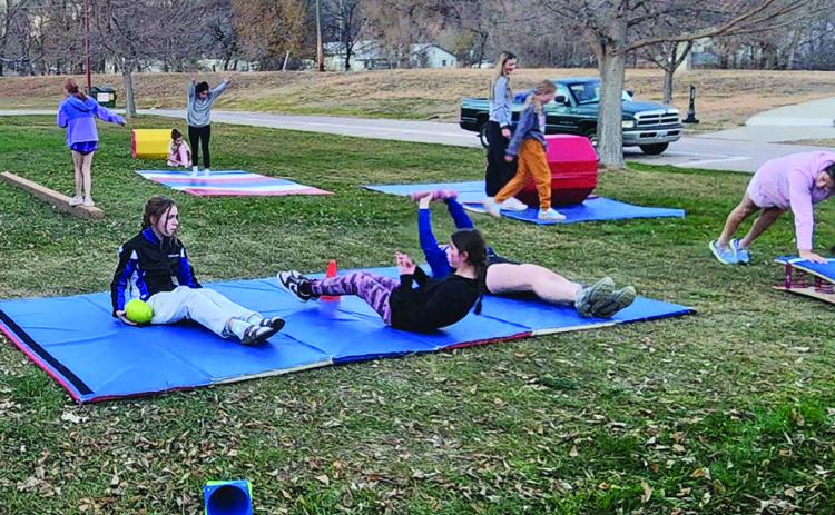 Due to the power being out at the Mueller Center last Thursday, Nov. 13, the Hot Springs Bison gymnastics team held a portion of its after-school practice outdoors.