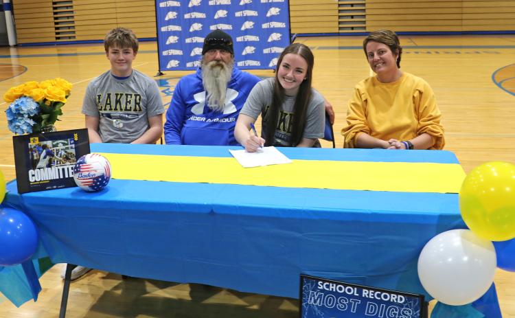 Riyahn Heinert signs to play volleyball at Iowa Lakes Community College while joined at the table by her brother Austin, dad Chad and mom Amber.
