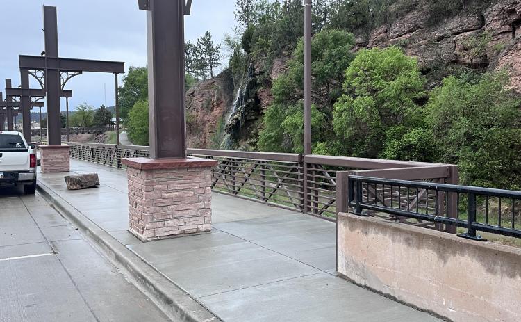 The north end of the suspended sidewalk is now open to pedestrians to transition to the nearby sidewalk, thanks to an recent 10-foot, 5-inch extension, made possible through a settlement with the designer. Photo by Brett Nachtigall/Fall River County Herald-Star