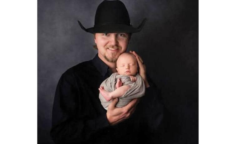 Chance Englebert holds his son Banks in this 2019 portrait.