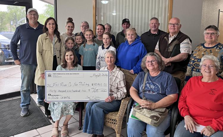 Fall River Area Foundation board members, on left, including Brett Nachtigall, and Lindsay Luper (both standing), along with Barb Miller and Cherie Largent (both seated) pose with representatives from 10 different local non-profits that were recently awarded a total of $40,910 in grants for various projects.