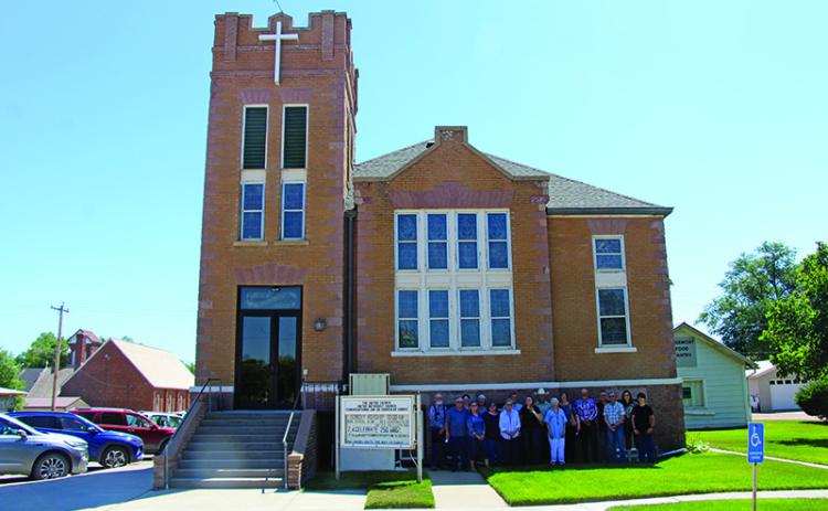 The United Church on 4th Avenue in Edgemont is hosting its 100th Anniversary servicing the township and surrounding areas since 1926 when the three-story building was completed and dedicated. Pictured are members before the church building as it now stands. The service and event begins at 10 a.m. on Sunday, July 19. Photo by Lance Borde/Fall River County Herald-Star