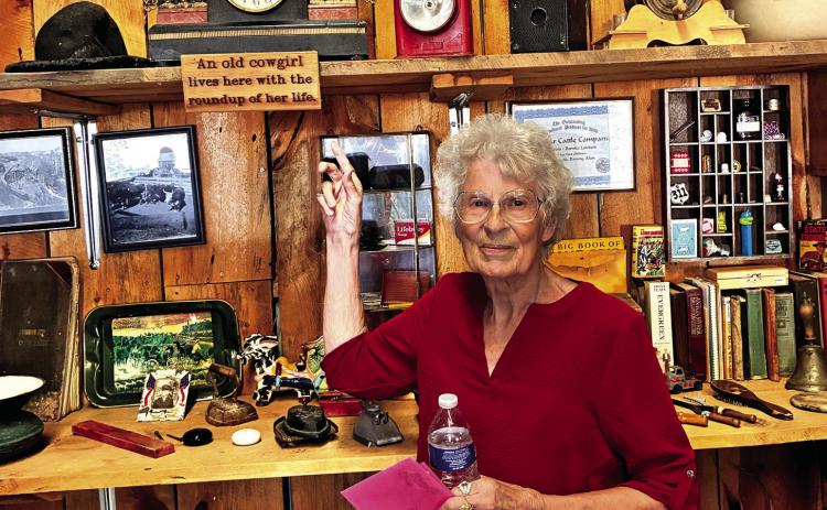Bernice Landers shows her collection of museum quality artifacts at the 140th ranch anniversary party. Photo by Charity Maness/Fall River County Herald Star