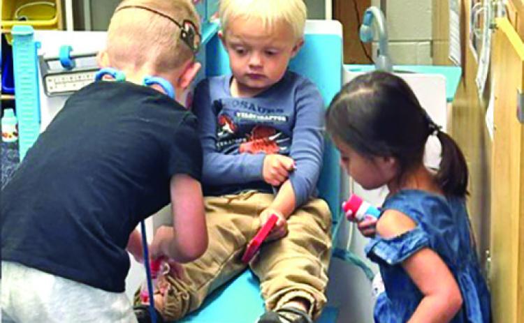 Hot Springs preschool students participate in a play activity during a Grand Opening event held last month. Courtesy photo