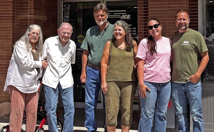 Three generations of Ace Hardware owners pose in front of the business located in downtown Hot Springs during an anniversary celebration this past Saturday. Pictured from left is Georgia and Tom Blatchford; Gary and Terry Slagel; and Kelly and Brad Bednar. Courtesy photo