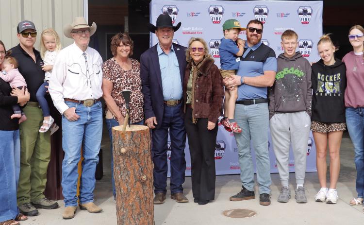 South Dakota Governor Larry Rhoden and his wife Sandy, center, pose with members of the Haskvitz family during a dedication and ribbon cutting held of the new S.D. Wildland Fire building located on the campus of the State Veterans Home. Also pictured from left are John and Laree Haskvitz and their two daughters; Don and Lujean Haskvitz; Ben Haskvitz and his son; Betsy Haskvitz and her children Cash and Ella. Below is the exterior of the building. Photos by Brett Nachtigall/Fall River County Herald-Star