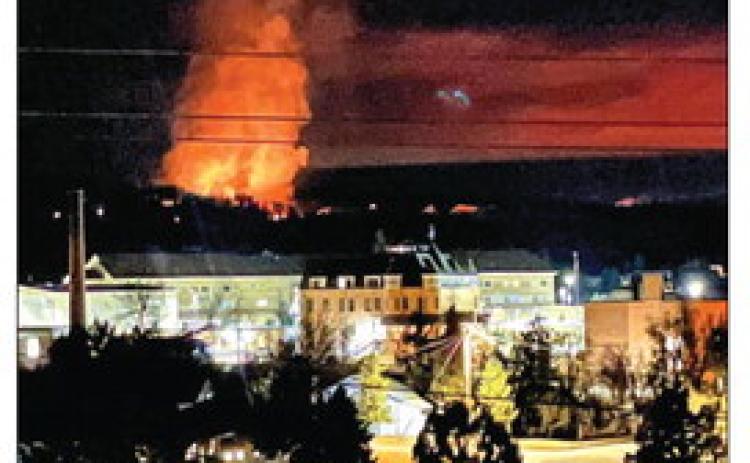 With the State Veterans Home featured in the foreground, this photo of the Hot Brook Fire about a mile away in the background, was taken at 11:30 p.m. on Thursday, March 12. Photo by Brett Nachtigall/Fall River County Herald-Star