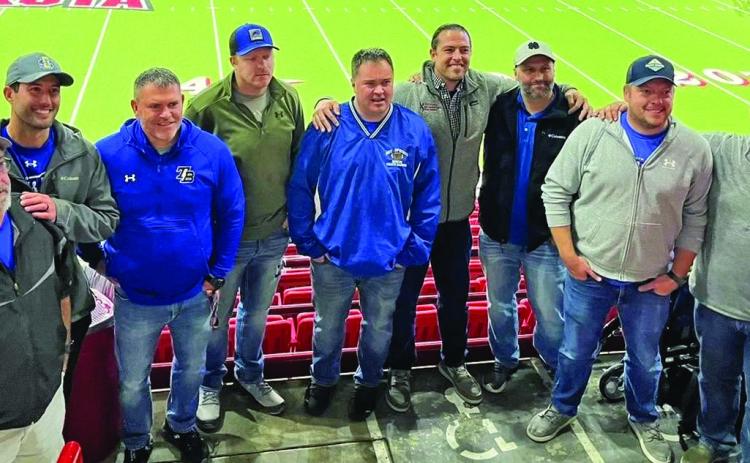 Twenty years later, a few of the members of the 2003 state runner-up football team pose for a photo during the 2023 state championship game when the Bison finally returned to the Dakota Dome to win the Class 11B state title over Elk Point-Jefferson. Pictured from left is Assistant Coach Scott Beehler, Riley Northrup, Head Coach Trent Pikula, John Haskvitz, Barry Hansen, Jeremy Pepin, Scott Beehler, Tyler Norton and Kyle Bachand.
