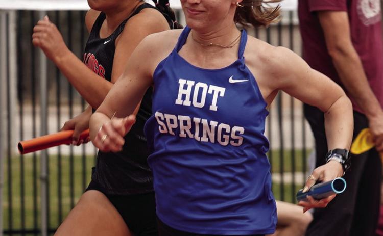 Hot Springs senior Carlie DeBoer pushes around the track during the 4x200m relay at last Friday’s Queen City Classic in Spearfish on the campus of Black Hills State University. Photo by Tim Potts