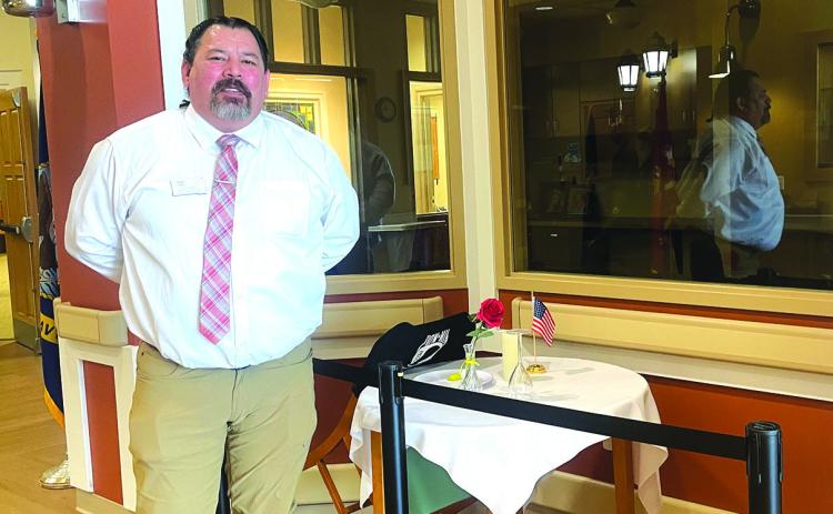 Photo by Beth Bogart/Fall River County Herald-Star Danny Tiger, the new State Veterans Home head, explains the “missing soldier” table in the main building’s entryway, an area he hopes to improve with a volunteer-staffed kiosk, part of his priority to create more connections with the local community.
