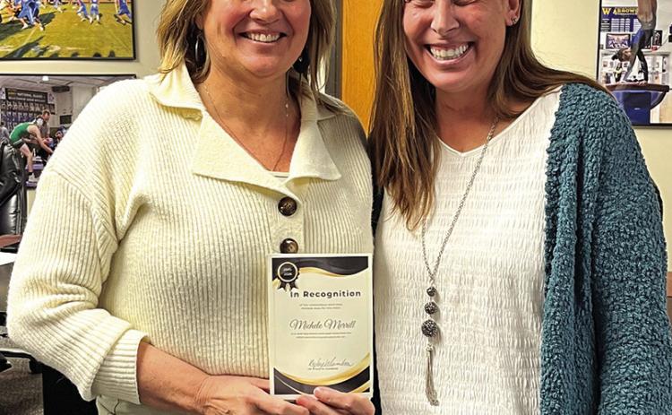 Hot Springs’ Michele Merrill, left, is presented a certificate as the school district’s Teacher of the Year from Superintendent Dr. Kyley Cumbow. Photo by Brett Nachtigall/Fall River County Herald-Star