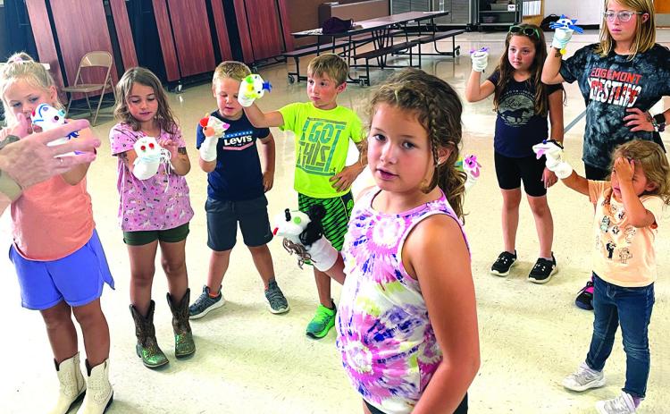 In this photo from last fall, YMCA youth member Jessamine Jones (front, center) participates in a free puppeteering activity with several other members during an Enhanced Learning Day. This event, and many others like it, are thanks in part to the South Dakota Arts Council and the YMCA’s 21st Century community learner’s grant. Courtesy photo