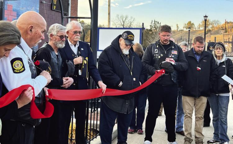 Prayer is held at the ribbon cutting ceremony for the Brick Memorial Garden to bless the memorial as a place of healing and remembrance. Pictured on the front page of this newspaper during the ribbon cutting ceremony held November 11, is Dick Daily, American Legion Rider Director, Dan Harley, Ron Richards and Commander Moe Lamphere. Photos by Charity Maness Fall River Herald Star