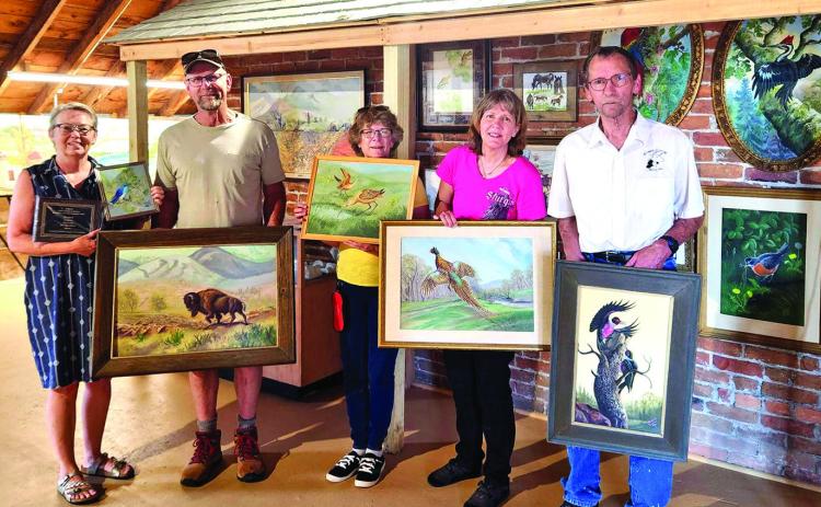 The Blaine Halls family is shown above donating numerous paintings by local artist, Robert Gossell, to the Pioneer Museum in 2024. Dawn Johnson, museum director, is shown on the left accepting the generous donation. Photo courtesy of the Pioneer Museum