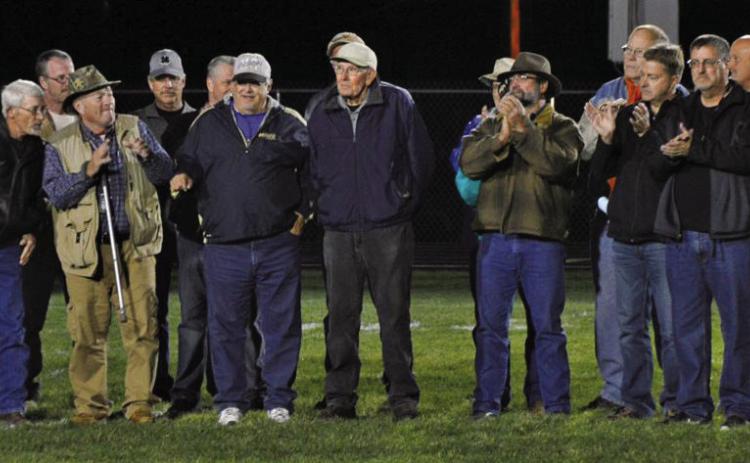 Hot Springs’ Jim Tays, center, stands on the Hot Springs High School football field while surrounded by members of the 1974 state championship football team. On this night in 2016, Tays was not only inducted into the HSHS Athletics Hall of Fame but the school’s middle school gymnasium was also named in his honor as the school’s Tays Center. Photo by Brett Nachtigall