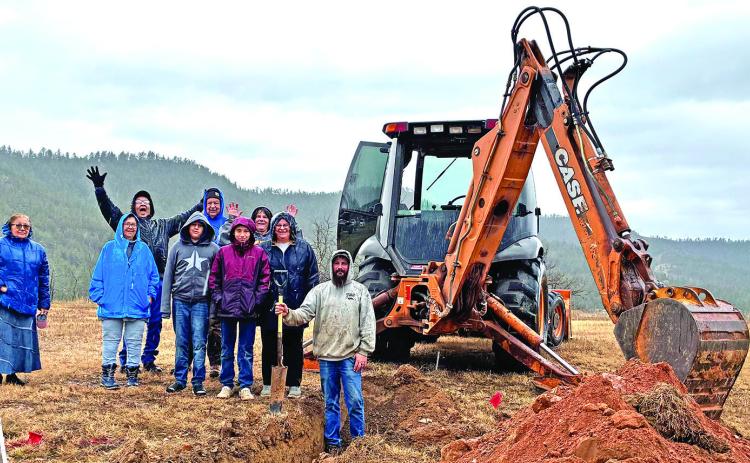 A little rain didn’t slow the enthusiasm of breaking ground for water at the Seven Sisters youth Garden for volunteers Wanda Marshall, Danialle Rose, Tom Ghost Dog, Tavin Cross Dog, Joe Ferrell, Tavon Cross Dog, Mary Kate Nelson, Kerry Pile and Brian Wynia.