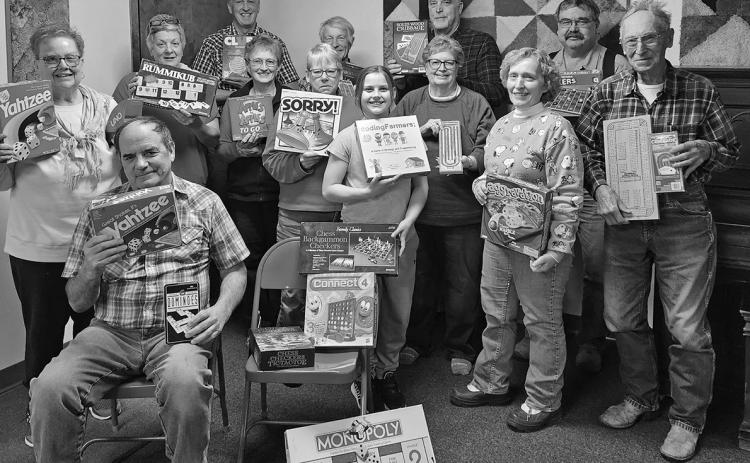 A group of “gamers” gather at the Oelrichs Community Center on Saturday night. Some felt the joy of winning and others experienced the agony of defeat. But all enjoyed chili, soup, bread, and desserts. Photo by Katie Merdanian/Fall River County Herald-Star