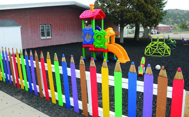 This colorful fence surrounds the playground at the Hot Springs Elementary School. Beginning next year, the district plans to add a second section to its preschool program to double its capacity to more than 30 students aged 3-5. However, to cover the cost of an additional preschool teacher, the district is hoping to fund raise from the community to avoid having to utilize Impact Aid funds. Photo by Brett Nachtigall/Fall River County Herald-Star