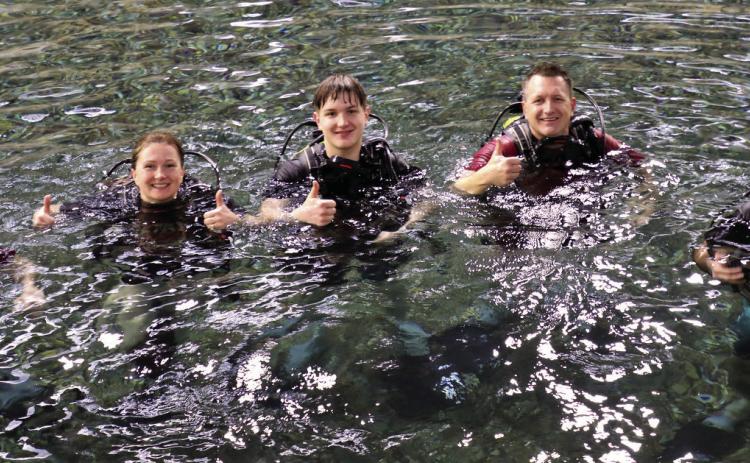 Reina Wilson, 16, Petra Wilson, Zachary Wilson, 16, Brian Wilson and Freyser Abarca enjoy a morning of introduction to scuba diving at Evan’s Plunge Sunday. Photo by Charity Maness/Fall River County Herald Star