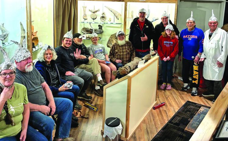 More than a dozen UFO enthusiasts, with rolls of aluminum foil in hand, attended the first UFO group meeting at World fossil Finder Museum earlier this month. For fun, participants donned their own tin foil hat designs, adding a light-hearted feel to the event. Photos by Charity Maness / Fall River County Herald Star