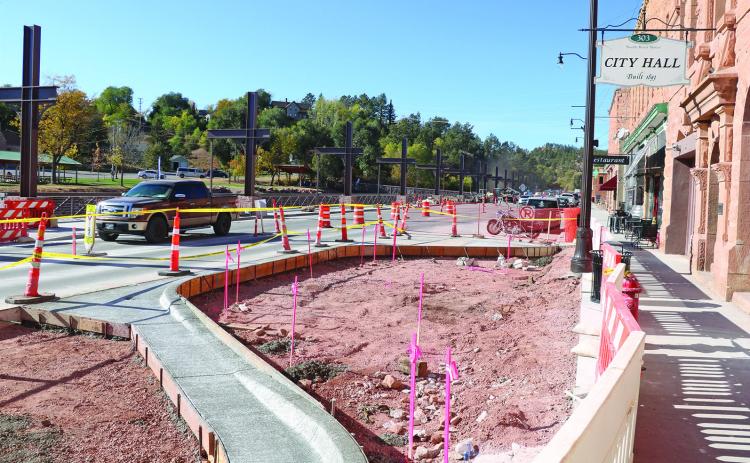 The concrete in front of Hot Springs City Hall was torn up last week so that crews could begin the construction of a new bump-out across from the pedestrian bridge that leads to Centennial Park. Public Works Engineer Tracy Bastian said the bump-out has been part of the plan all along, but could not be constructed until the southern portion of the suspended sidewalk was completed, and thus allowing more room for traffic. Photo by Brett Nachtigall/Fall River County Herald-Star