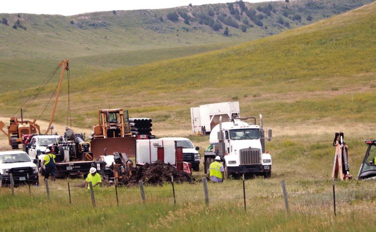 Workers with WyoDak Energy Services, LLC, from Buffalo, Wyo., work along Hwy. 79 near mile marker 40, about six miles north of Buffalo Gap. The company started a 15 mile water pipeline project this past April south of Buffalo Gap for the Fall River Water Users District and are continuing to work north towards Fairburn. Photo by Brett Nachtigall/Fall River County Herald-Star