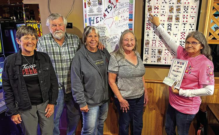 Paula Laughlin of Hot Springs, far right, points to the location of her winning card which earned her a total of $39,456 in the Can Man Trade Scholarship Fund’s weekly Jack of Hearts contest at the Winner’s Circle. Also pictured from left are scholarship fund board members Dusty Pence, Tom Merrill, Jacki Lockwood and Donna Merrill. Photo by Brett Nachtigall/Fall River County Herald-Star