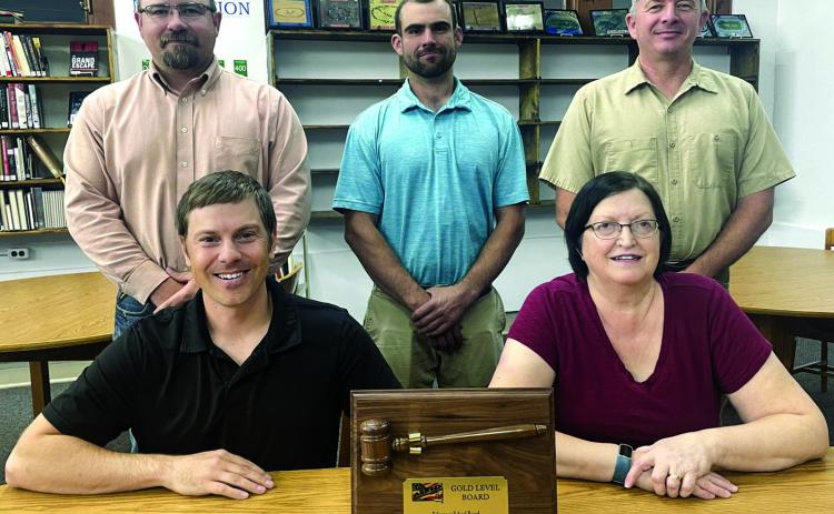 The Edgemont School Board was recognized for their dedication and received the Gold Level ALL Award by the Associated School Board of South Dakota. Pictured are hane Miller and vice president Susan Humiston, and back row Dustin Ross, Sam Whitney and president Gary Darrow. Photo by Diane Stevens