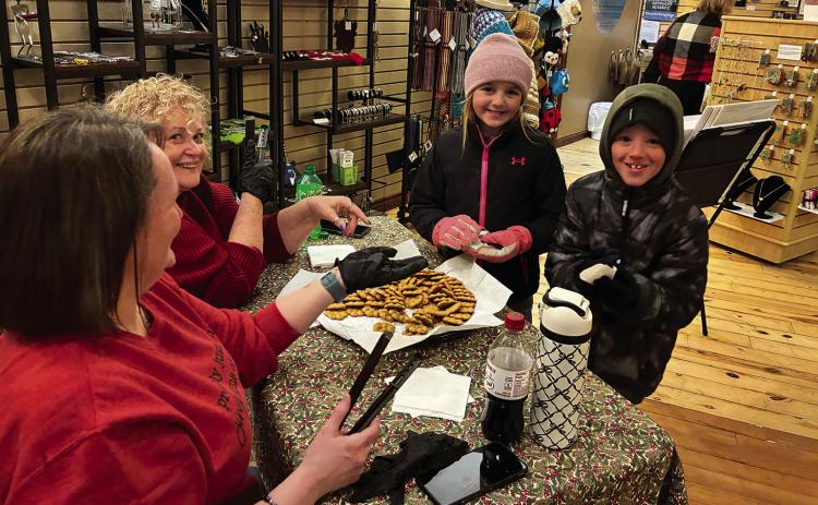 Dylan White, 8, and his sister Jemma White, 9, sample cookies at Chautauqua Artisan Market from artisans Jo Schrieder and Kari Mullock. Photos by Charity Maness / Fall River County Herald Star