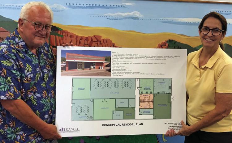 Pastor David Cook and Kay Birkholt hold the conceptual remodel plan for their current location at 107 N. Chicago in downtown Hot Springs. Photo by Charity Maness/Fall River County Herald-Star