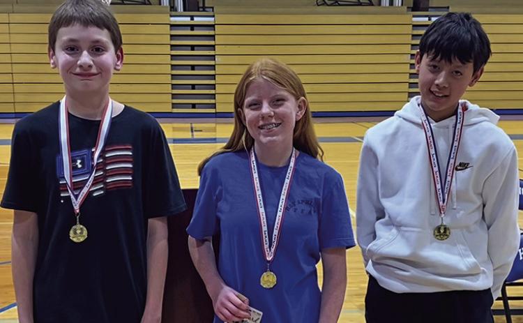 The top three were in last week’s Hot Springs Spelling Bee were middle schoolers, from left: 6th grader Coy Bringewatt (2nd place); 8th grader Cassidy McClure (1st place) and 3rd 7th grader Dalton Hunter (3rd place). Courtesy photo