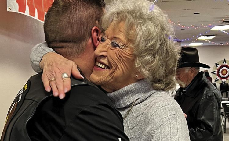 Sue Brenna, US Army Nurse 1969-70, 95th evac hospital, enjoyed a hug from Jace Thomas, Battle Mountain Adjutant Squadron 71. Photo by Charity Maness/Fall River County Herald Star